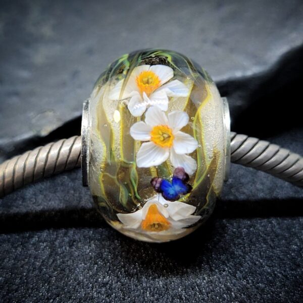 Narcissus flower bead with blue butterfly